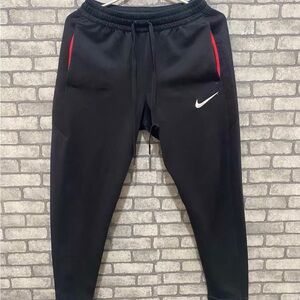 Nike Kids Black Sweatpants with Red Accents
